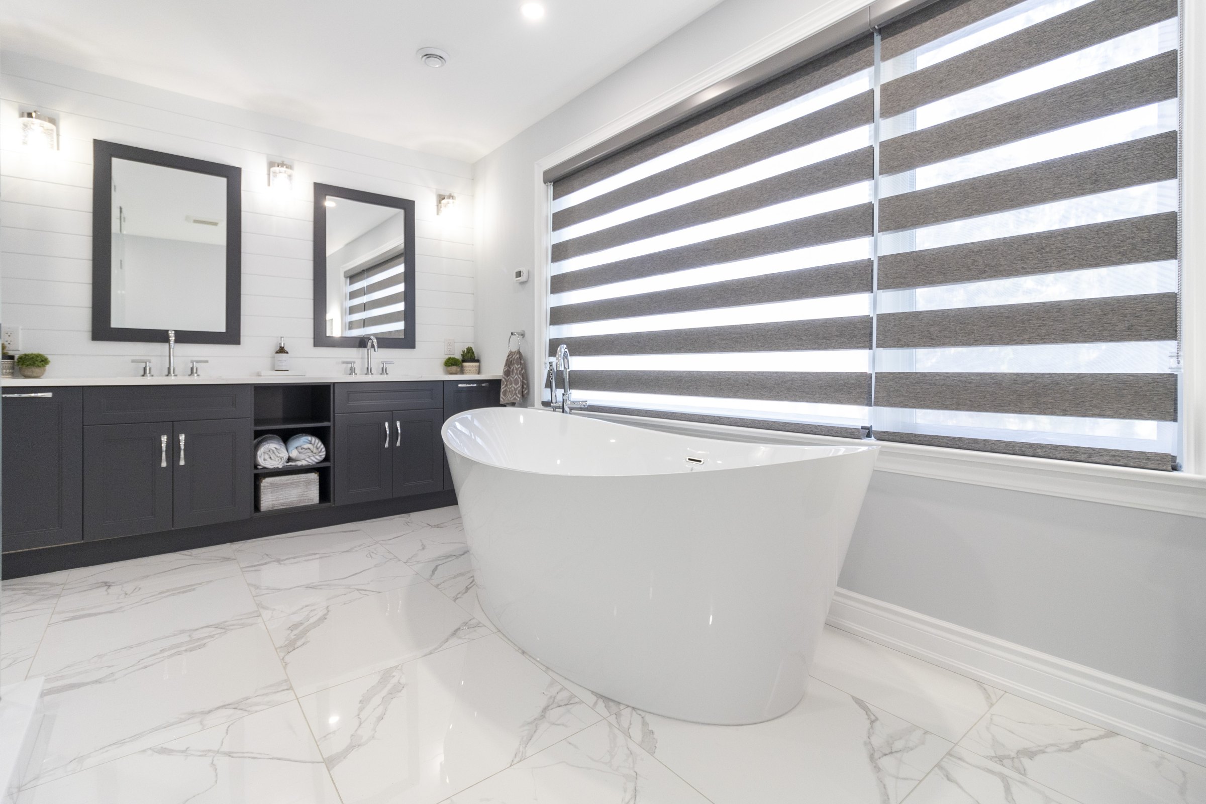 Marble ensuite with freestanding tub built by High Peaks Contracting Ltd. in a Mississauga renovation